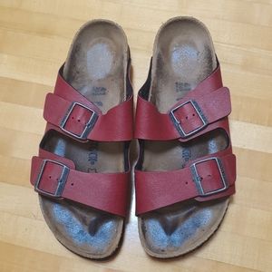 Birkenstock dark red two strap sandal.